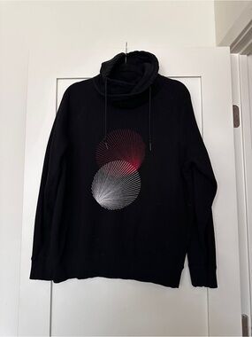H&M Black Turtleneck Pullover with Red and White Spiral Motif